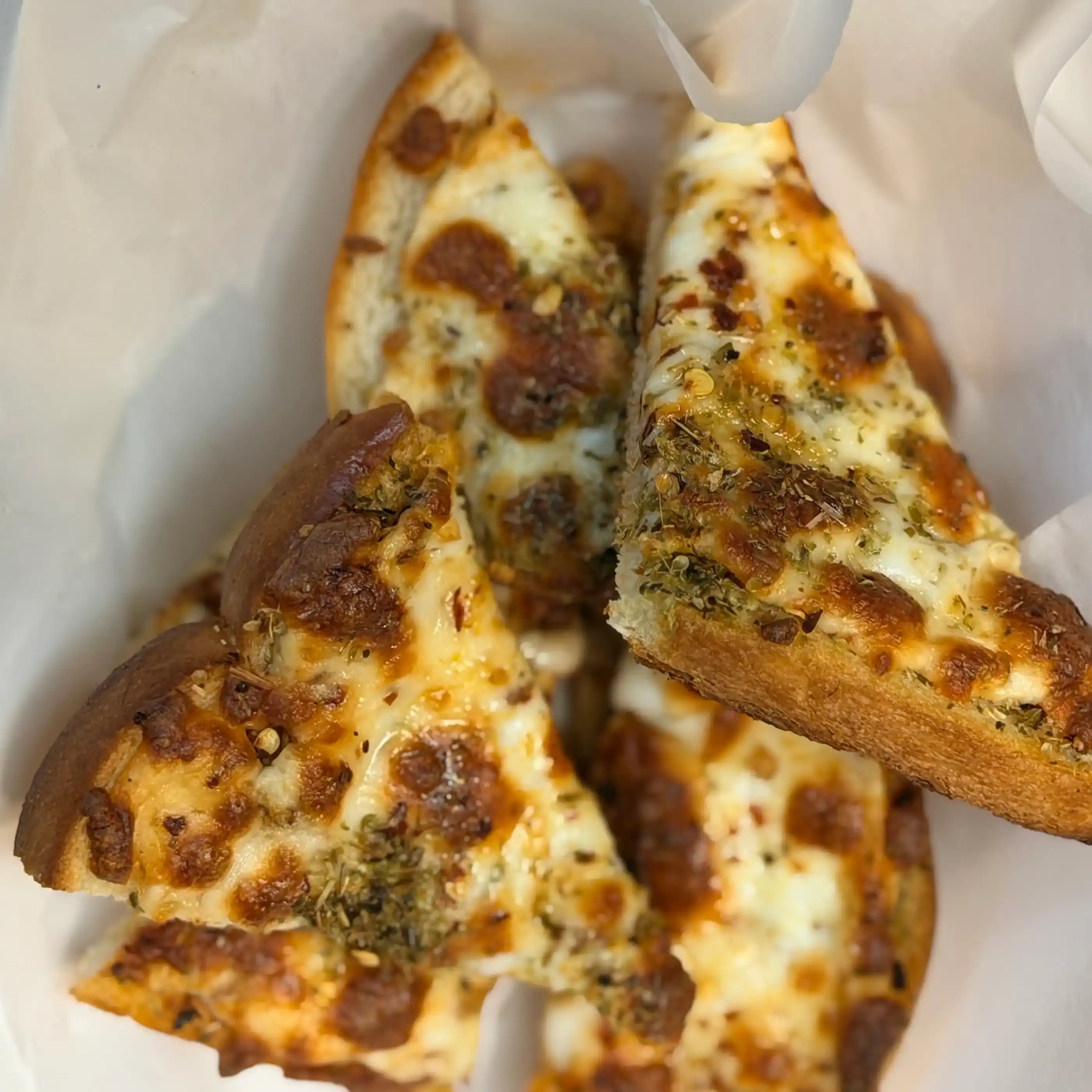 Cheese toast — Golden-brown toast, generously layered with a blend of melted, bubbling at Hashtag India, Overland Park